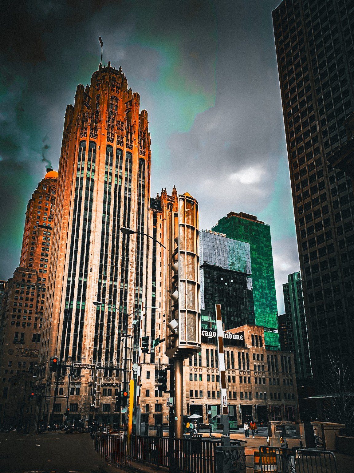 Chicago Tribune Tower rising beneath a dramatic teal and gray sky